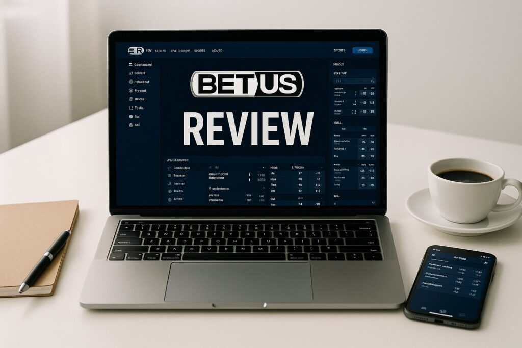 Laptop displaying BetUS Review website interface highlighting its features alongside a smartphone and coffee cup on a desk providing a comprehensive BetUS Review insight.