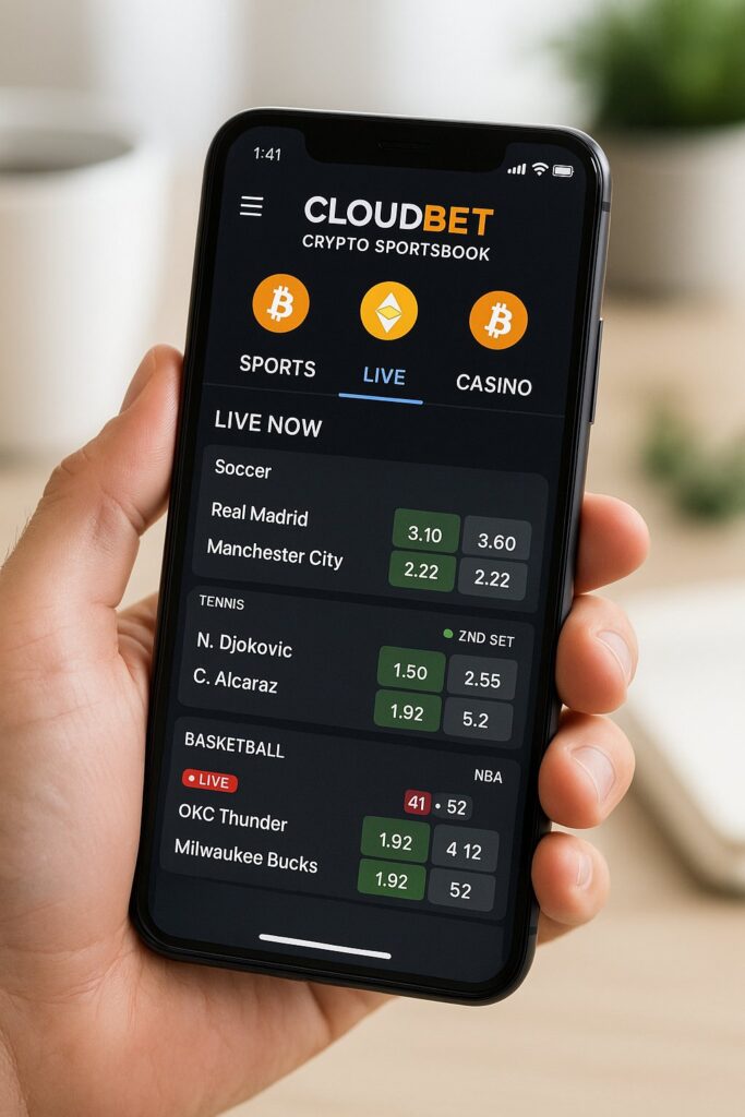 Person holding a smartphone displaying the Cloudbet Crypto Sportsbook Mobile App with sports betting options including soccer tennis and basketball live updates.